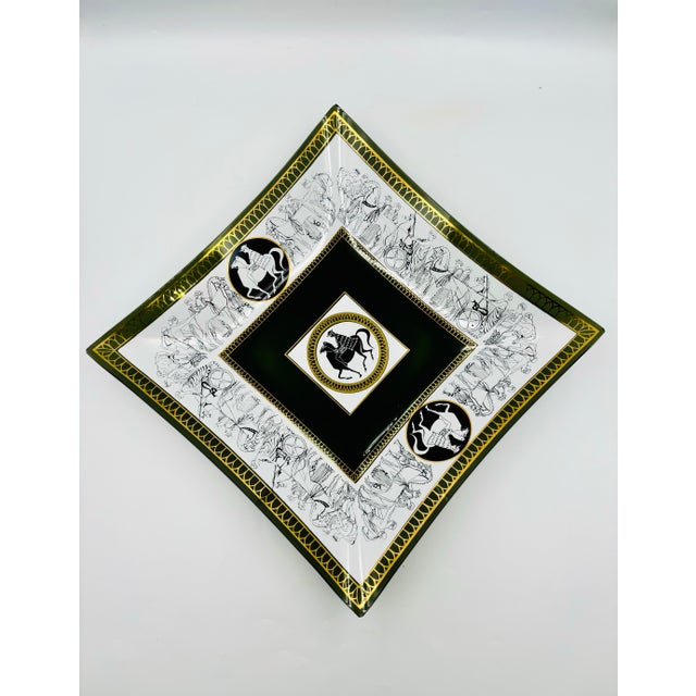 This stunning mid-century/Hollywood Regency tray features a Grecian motif on dark smoke colored glass by Aldon Glass. The...