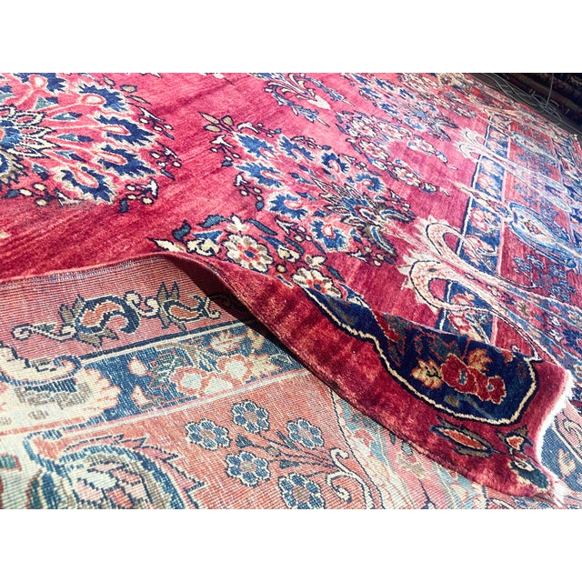 This outstanding Antique Persian Mohajeran Sarouk is an exceptionally decorative example from the celebrated weaving...