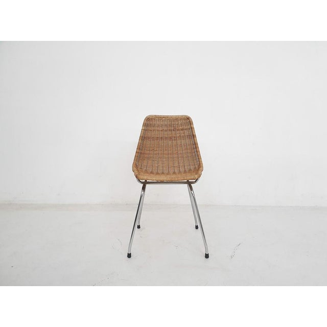 About this item Metal feet and rattan seating. The rattan is in good condition, the frame has been welded. Attributed to...