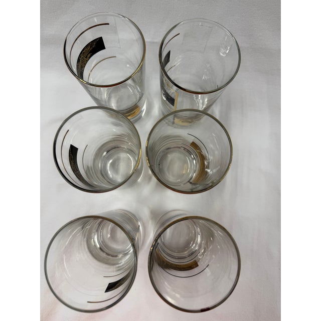 Beautifully simple addition to any bar cart to cocktail bar. Black and 22 carat gold trim and eagle on each glass.