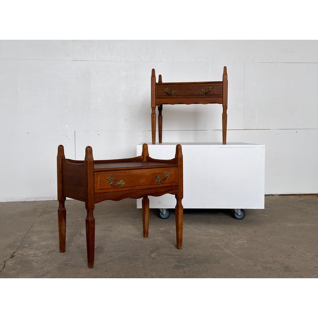 This pair of oak bedside tables was designed by Henning Kjærnulf and produced in Denmark during the 1960s. Each stands on...