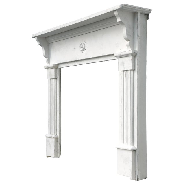 Antique Wooden Fireplace Mantle in Creamy White Chaulk Paint with minimal distressed patina. Fluted details on both sides...