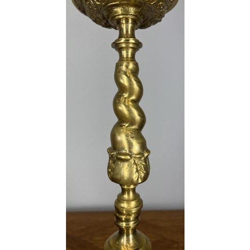 This Vintage French brass candelabra is a striking and highly decorative piece, featuring bold classical detailing and a...