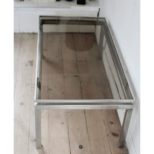 - Coffee table Guy Lefevre - Produced by Maison Jansen - Steel and smoked glass - Made circa 1970 - Fine, solid and stable
