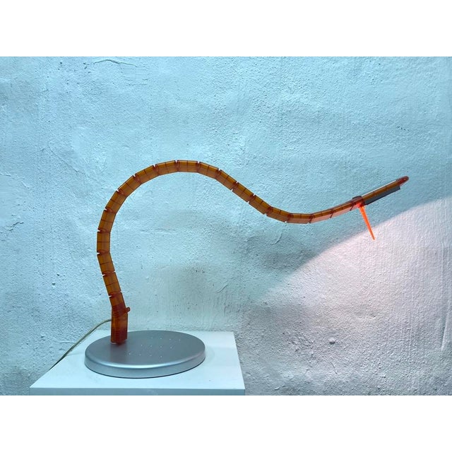 Flexible Table Lamp in Orange by Tobias Grau, 2000s, in Very Good conditions. Designed from 2000 This piece has an...