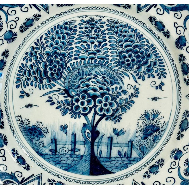 A fine 18th century Dutch Delftware charger decorated in the iconic Tea Tree pattern, one of the most enduring and...