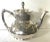 Meriden Britannia Co. 1880's silver plated aesthetic pattern teapot and creamer. The body decorated with an asymmetrical...
