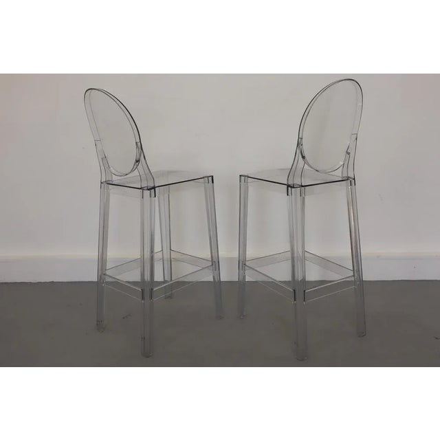 A pair of stools from Kartell's famous Ghost family, the One More, One More Please bar stool refers in its form and...