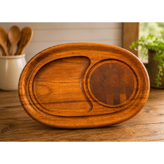 Elevate your entertaining with this beautifully crafted vintage Dansk teak serving tray, featuring a built-in end-grain...