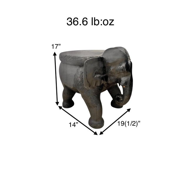 A solid, heavy hand-carved wood elephant — use it as a plant stand, side table, or sculptural accent. These carved...