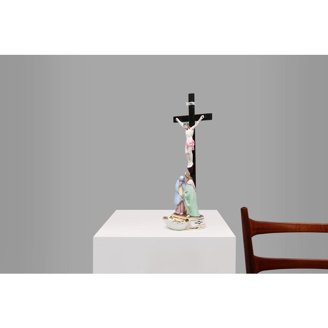 A vintage Vieux Andenne Belgium Holy water font in porcelain with crucifix from the 1950s, Belgium. This delicate statue...