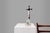 A vintage Vieux Andenne Belgium Holy water font in porcelain with crucifix from the 1950s, Belgium. This delicate statue...
