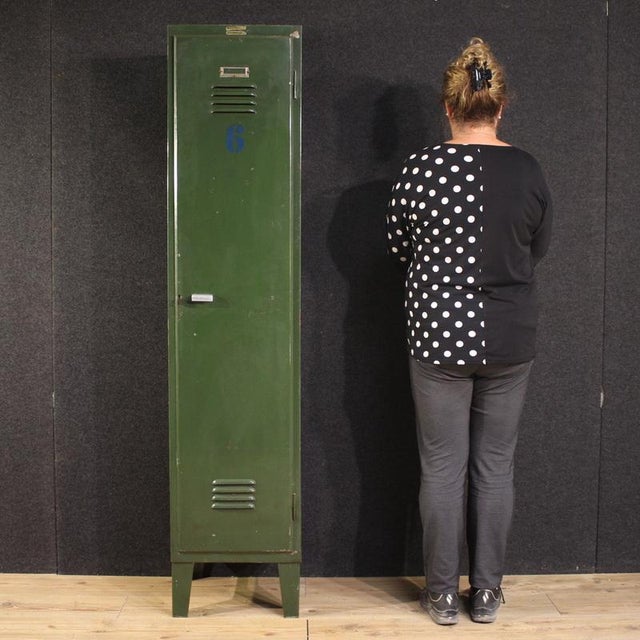 Italian cabinet from the 1960s or 1970s. An industrial-style piece made of green lacquered metal. This single-door unit is...