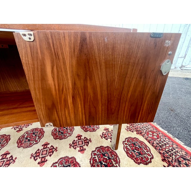 Maker: Briltrite Designer- Herman Miller Where: Canada When-late 60’s Materials- Black Walnut, Chrome (drawer pulls, door...