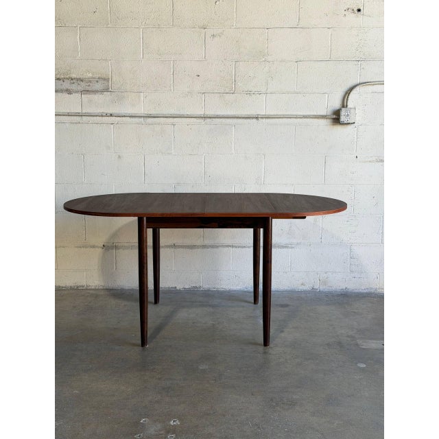 This versatile dining table features an expandable design with pull-out draw leaves. The square top effortlessly extends...