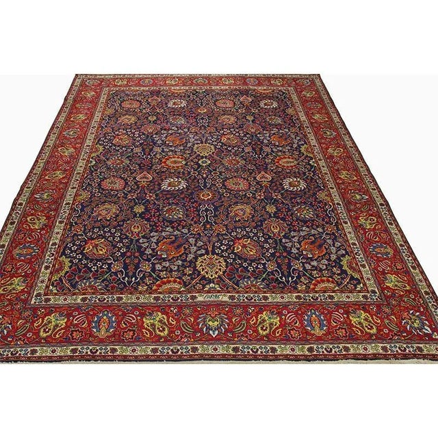 ACTUAL SIZE: 9’10” x 13’2″ PRIMARY COLOR: Navy / Red AGE: Old MATERIALS: Wool FOUNDATION: Cotton PRODUCTION: Handwoven,...