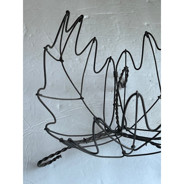 Beautiful Vintage Twisted Wire Leaf Basket. Three leaves form the sides of this basket and twisted wires form the three...