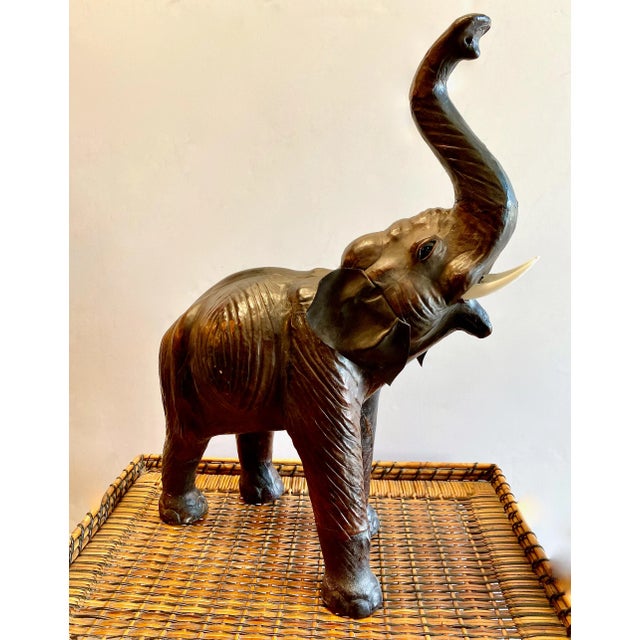 This a great example of a mid-20th century, c. 1950's, Elephant sculpture. The elephant has been eloquently detailed with...