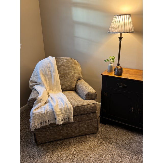 In Like-New Condition! Smooth-gliding swivel rocker in neutral colors. Very comfortable! Zero issues with fabric or...