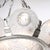This French Art Deco frosted glass chandelier, created circa 1935, exudes an understated elegance with its intricate grape...