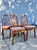 Mid-century modern teak dining chairs. Set of five in the style of Benny Linden. With an ergonomic seat back, these have a...