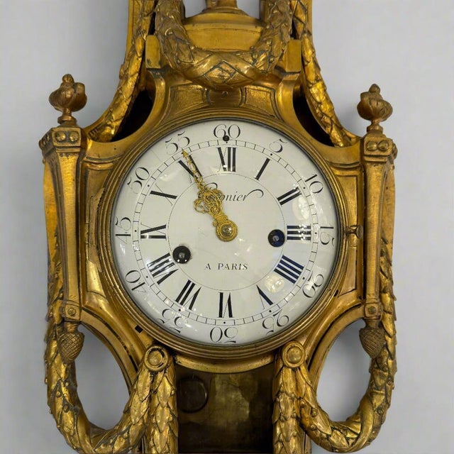 A rare and important Louis XVI clock by Cronier, Paris, France circa 1790. Crafted in fire-gilt bronze with a round convex...