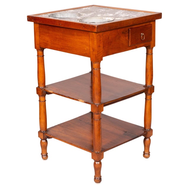 Square gray and white marble top with circular bottle holders with tole liners over a frieze with small drawer, turned...