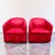 Pair of 1980s vintage swivel club chairs in a red suede fabric. These chairs have a retractable swivel mechanism,...
