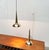 Two impressive brass pendant lights from Denmark. The most striking detail of these lights is the tapered cone that...
