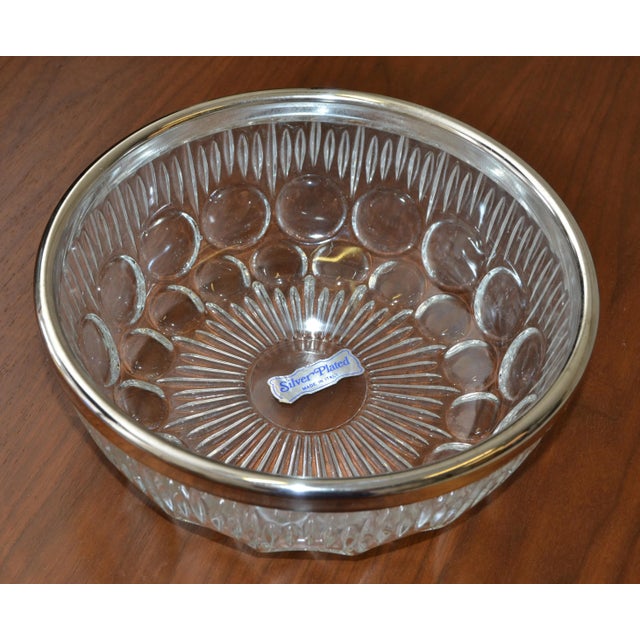 Circa 1950s Art Deco Style transparent Cut Crystal bowl with rare bubble design from France decorated with a Silver plate...