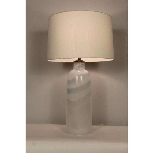 A blend of swirled Murano glass.Light gray into a cloud white base. Somewhat abstract, Simple in desig..A beautiful...