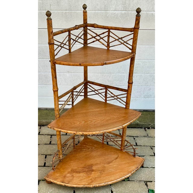 Beautiful Victorian corner three-tier etagere. Shelves made of oak, three brass finials on top boll front feet. Can be...