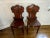 A pair of finely solid mahogany William IV English hall chairs with a prominent raised cartouche-shaped back slat, carved...