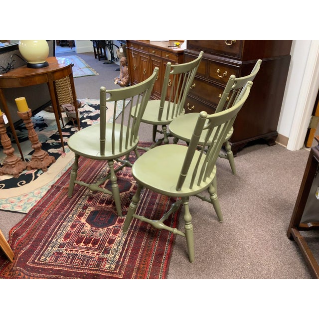 Set of four Windsor dining chairs with sage green finish, marked by the Vermont maker, Hale Furniture Company. Circa 1970....