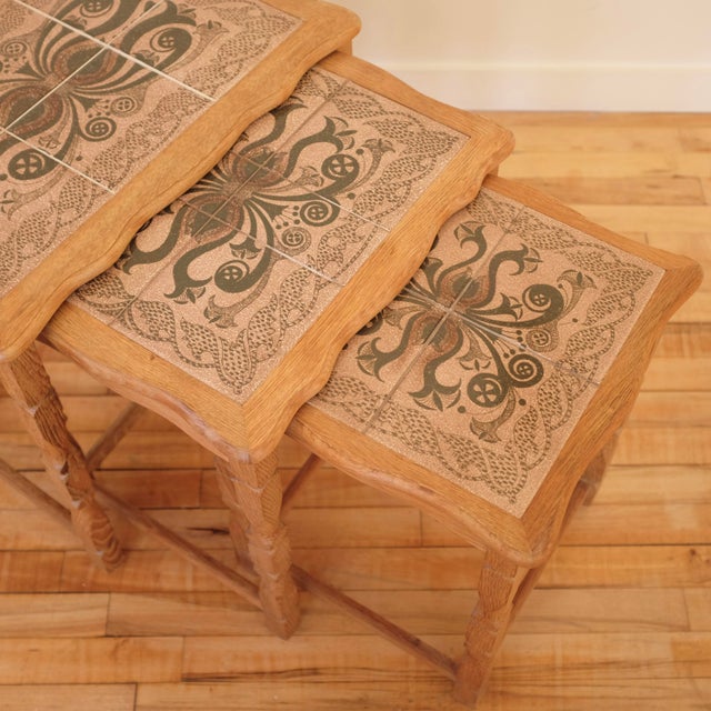 Nestling Side table in Oak and Ceramic tiles Attributed to Henning Kjaernulf, Denmark, circa 1960s. Consisting of 3 tables...