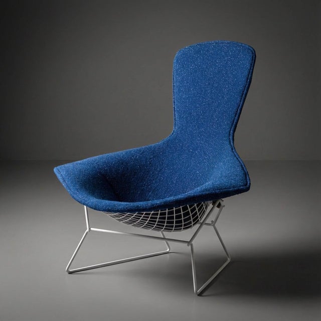 At a Glance: - An early example of Bertoia’s Bird Chair design, fully restored. - The newly crafted upholstered cover...