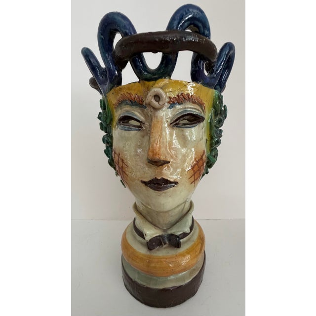 A striking and highly unusual companion pair of Italian majolica figural head vases by Cantagalli of Florence, dating to...