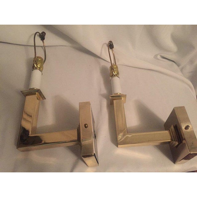 A very chic pair of 1970s Vintage Modern Brass Square Arm Wall Lamps in the Style of Karl Springer. All parts including...