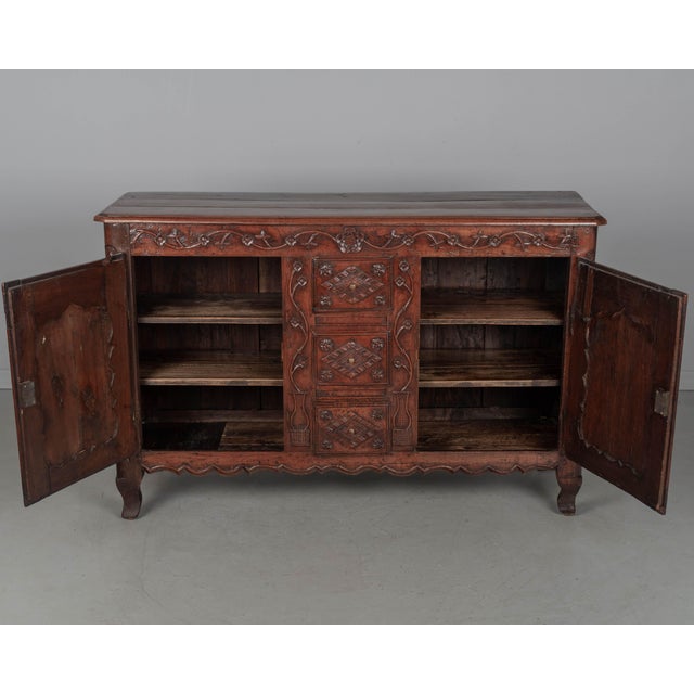 An 18th century Country French enfilade, or sideboard, from Picardie (Northern France) made of solid apple wood and oak....