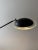 A slender floor lamp in which the construction forms an important part of the design. The long arm balances on the central...