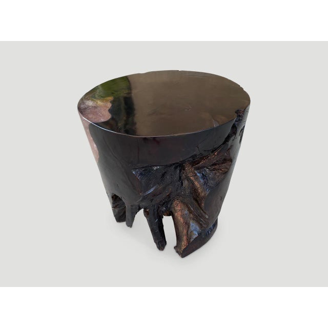 The organic round cracked resin side table is made from teak infused with resin which resembles a unique quartz crystal....