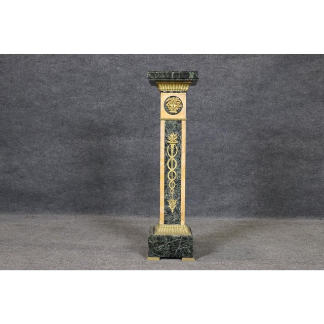 Introduce a commanding statement of neoclassical elegance with this extraordinary marble pedestal column, masterfully...