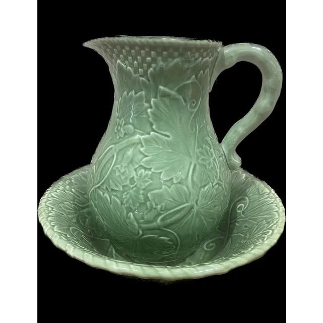 A fun set consisting of a large ceramic bowl & matching pitcher. A very popular pattern and vibrant green. Could not read...