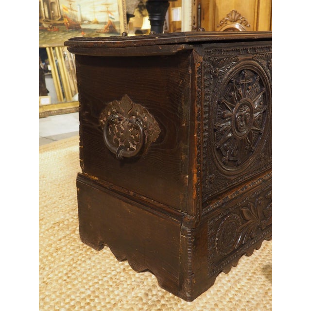 A beautiful and robust Spanish trunk, the carvings on the front façade are large and vibrant, accented by a deep brown...