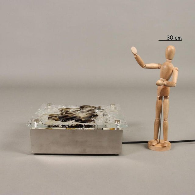 Ceiling/wall lamp, in chromed aluminum and blown glass. This piece is attributed to the mentioned designer/maker. It has...