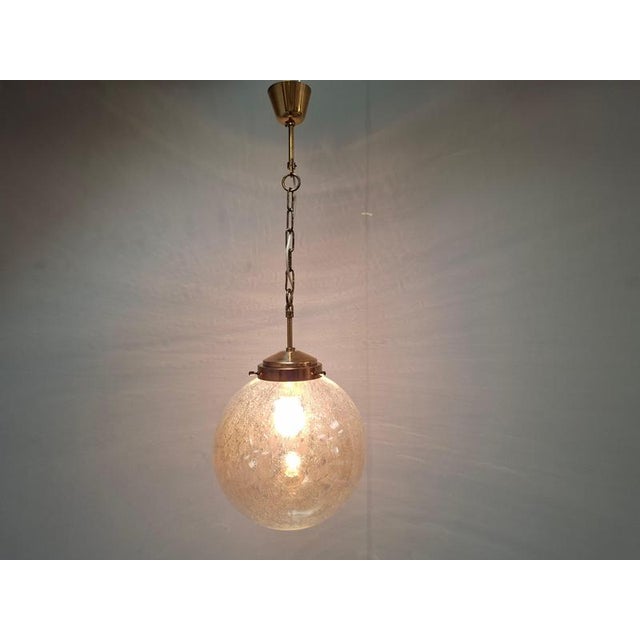 This elegant midcentury pendant light was produced by kamenický šenov in czechoslovakia during the 1960s, a region...