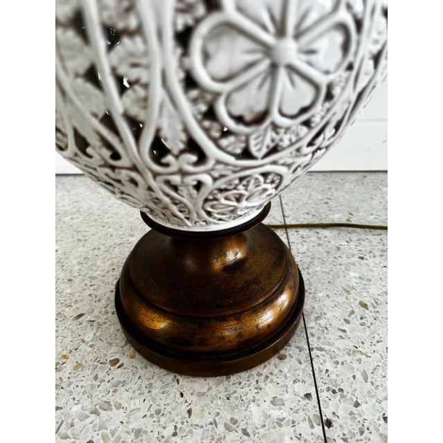 Vintage ceramic lamp with beautiful details and accents. Comes with shade in excellent condition. Must have for your mid-...
