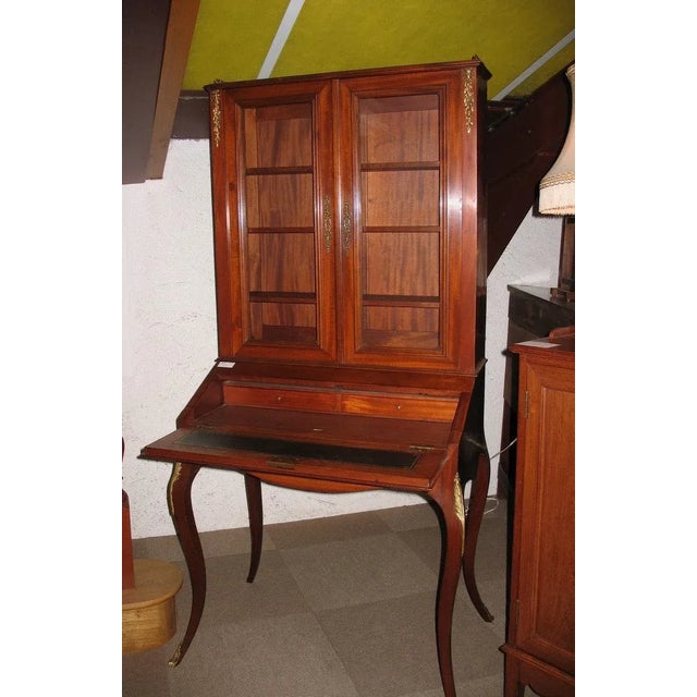 Small lady's desk with Louis XV style display case in solid mahogany opening with 2 glass doors at the top, a flap...
