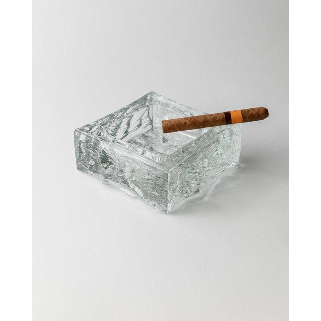 This large vintage Murano glass ashtray is a stunning piece from Italy in the 1970s. Its clear glass design features a...