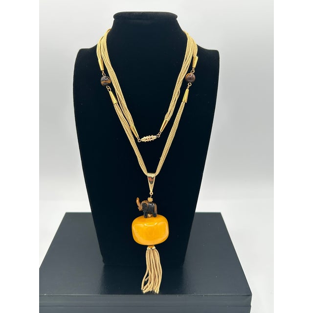 Step into a world where history, artistry, and symbolism unite in a single breathtaking piece. This statement necklace is...
